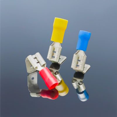 Actual product photo of three-color insulated back-type quick disconnect brass terminals with tin plating